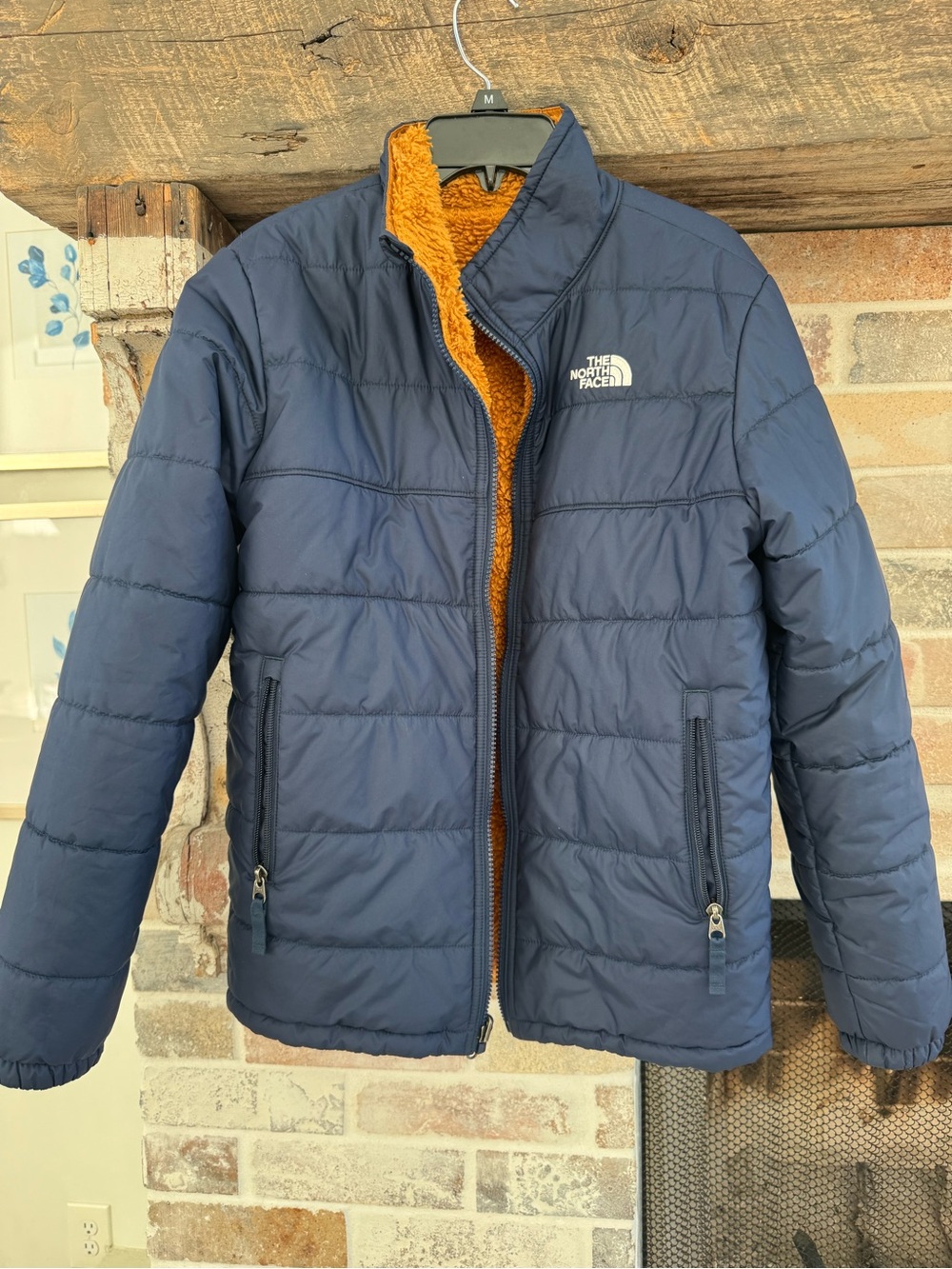 The North Face Navy Blue Puffer Jacket with Orange Sherpa reversible